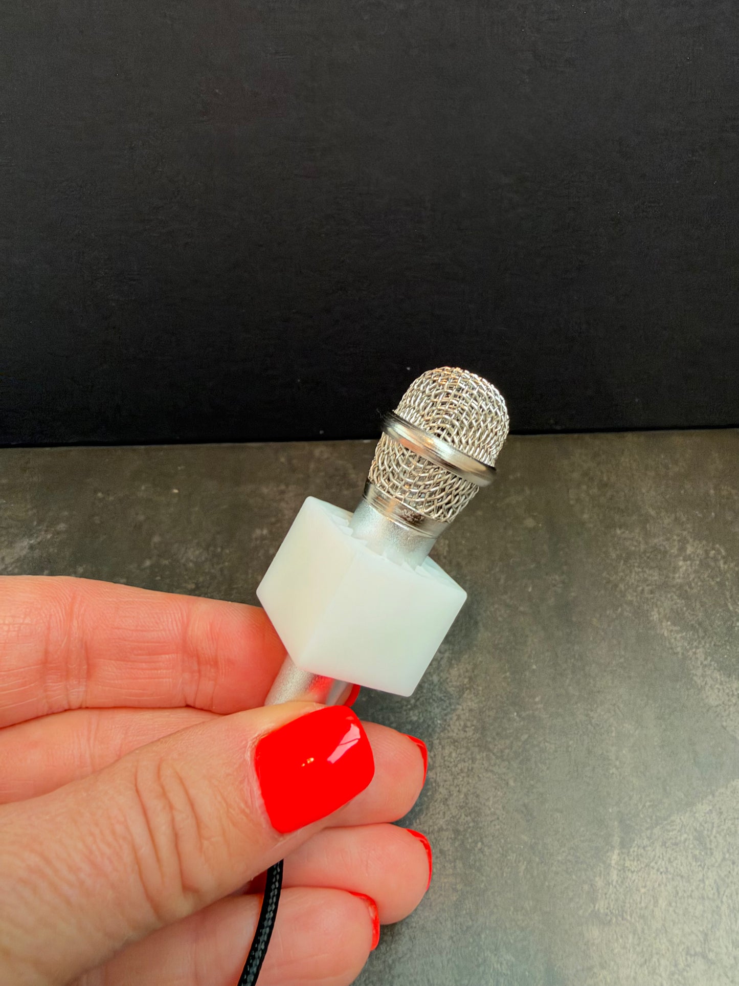 Blank mini microphone and mic block shown in hand